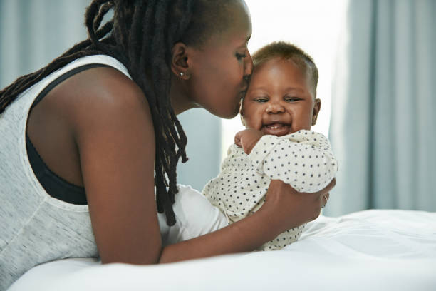 A woman holding her baby