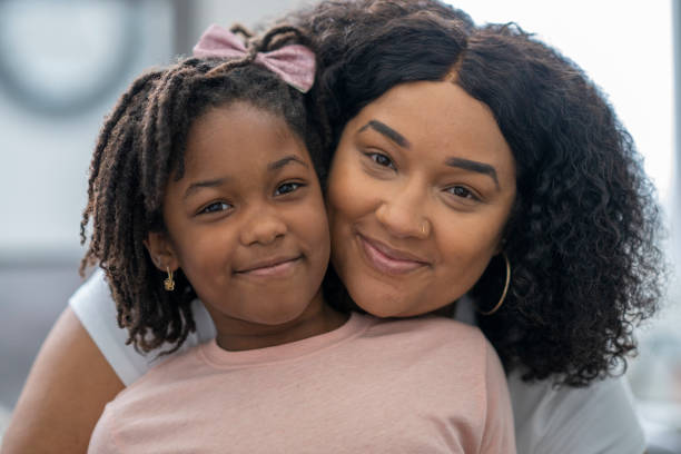 Portrait of an attractive black mother enjoying time with her young daughter