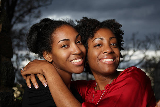 Two women hugging and smiling